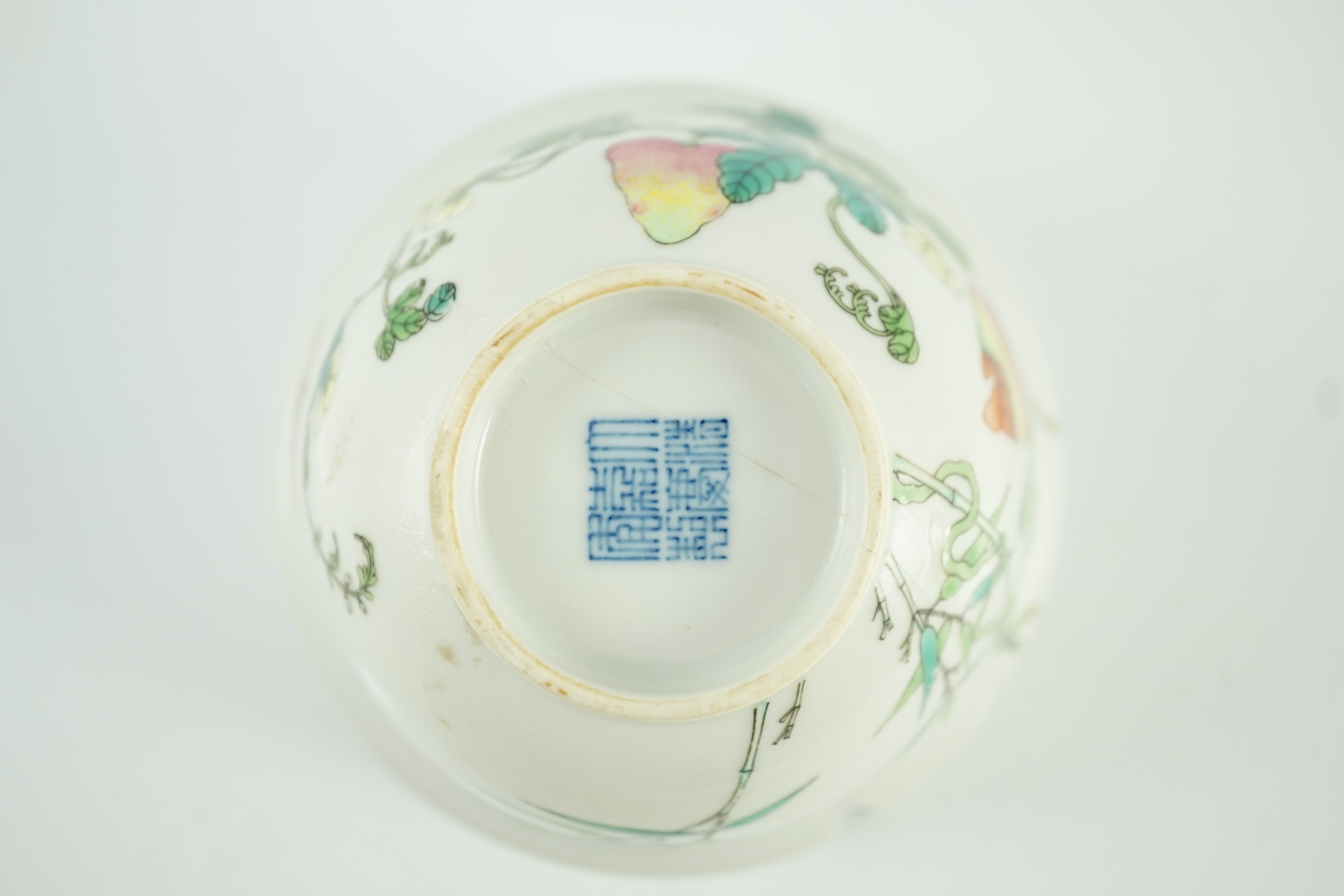 A Chinese famille rose bowl, Jiaqing seal mark and of the period (1796-1820), 10.7cm diameter, 6.3cm high, extensive damage